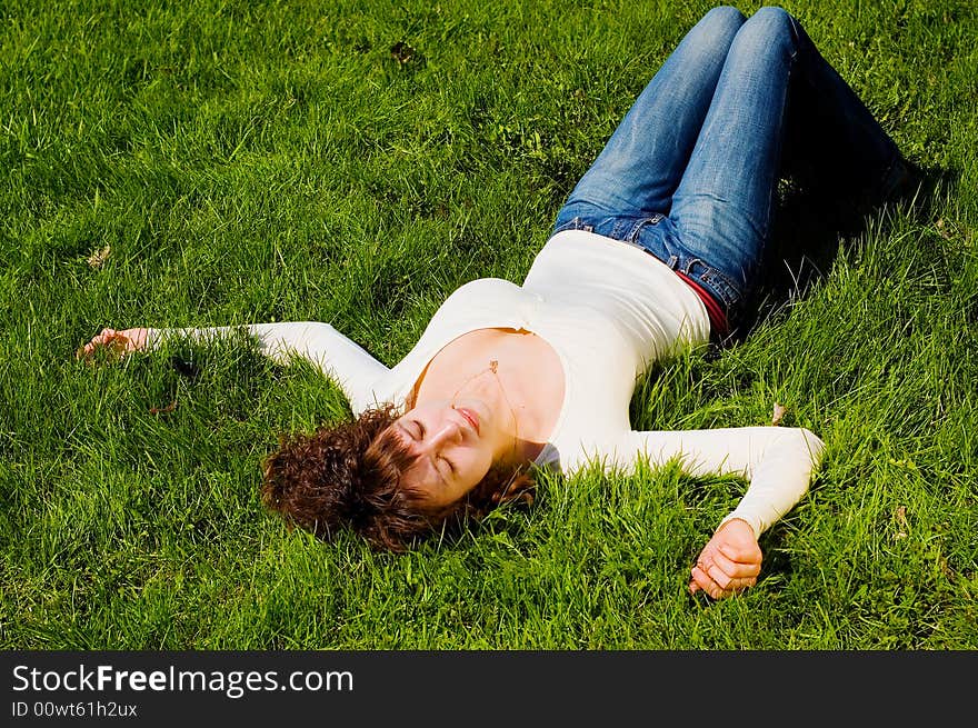 Girl is relaxing on the grass