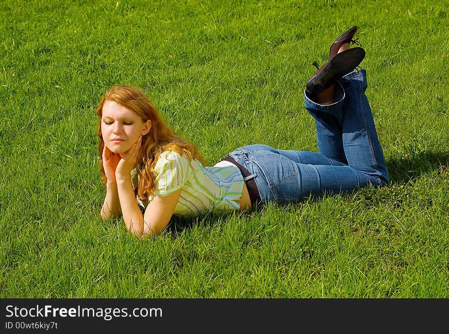 Girl is relaxing on the grass