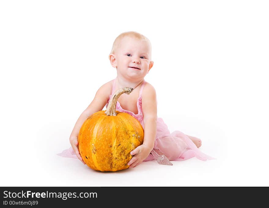 Smiling Little Girl Embraces A Pumpkin