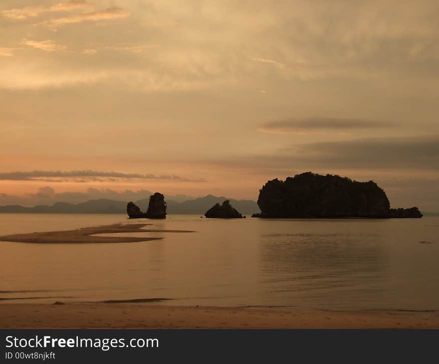 Sun setting over rocky islands and sand bar of Tanjung Rhu beach, Langkawi. Sun setting over rocky islands and sand bar of Tanjung Rhu beach, Langkawi