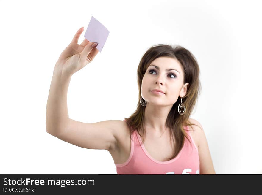 A girl sticking a note on the glass wall. A girl sticking a note on the glass wall