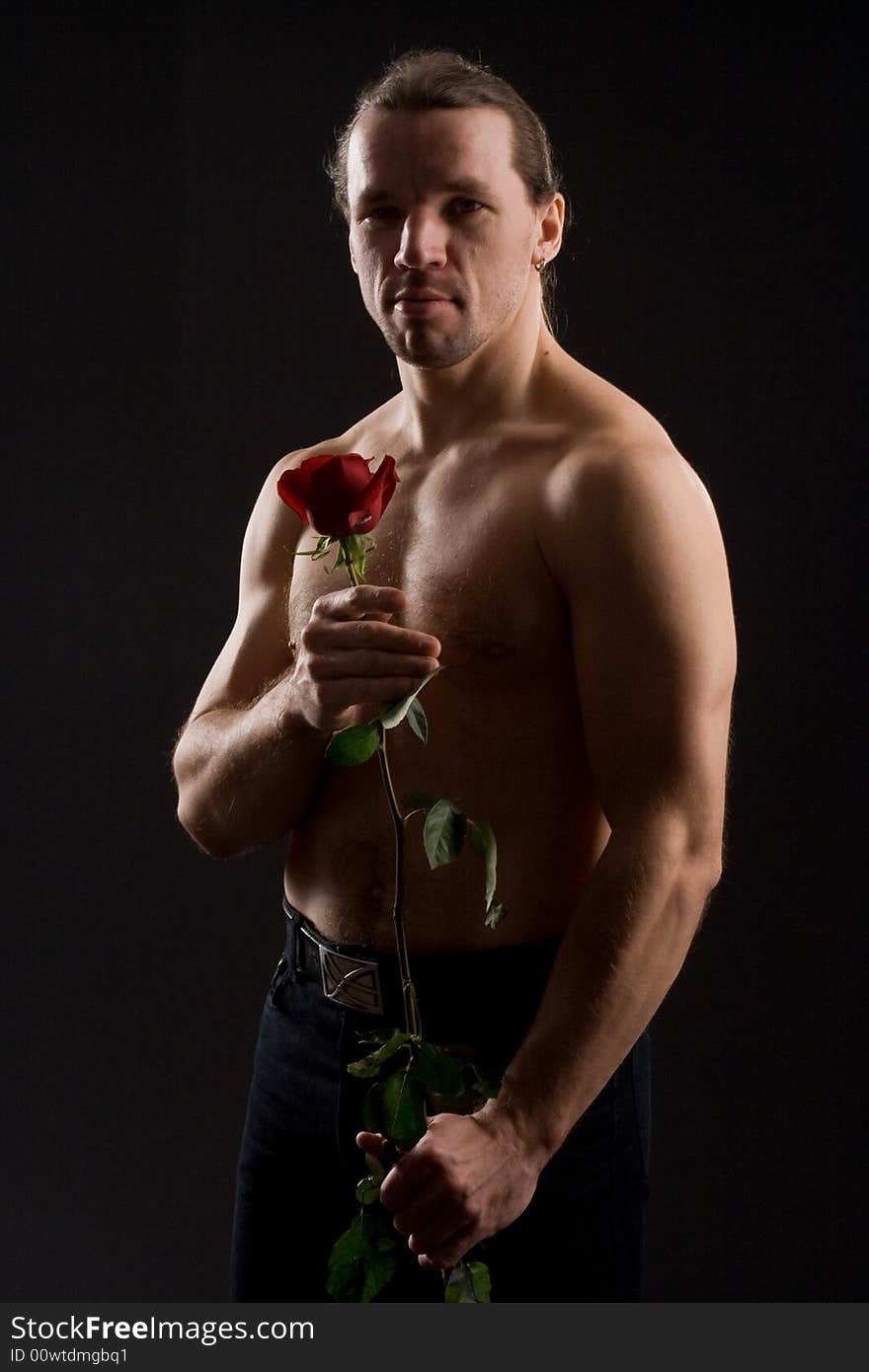 Standing romantic man with red rose. Standing romantic man with red rose