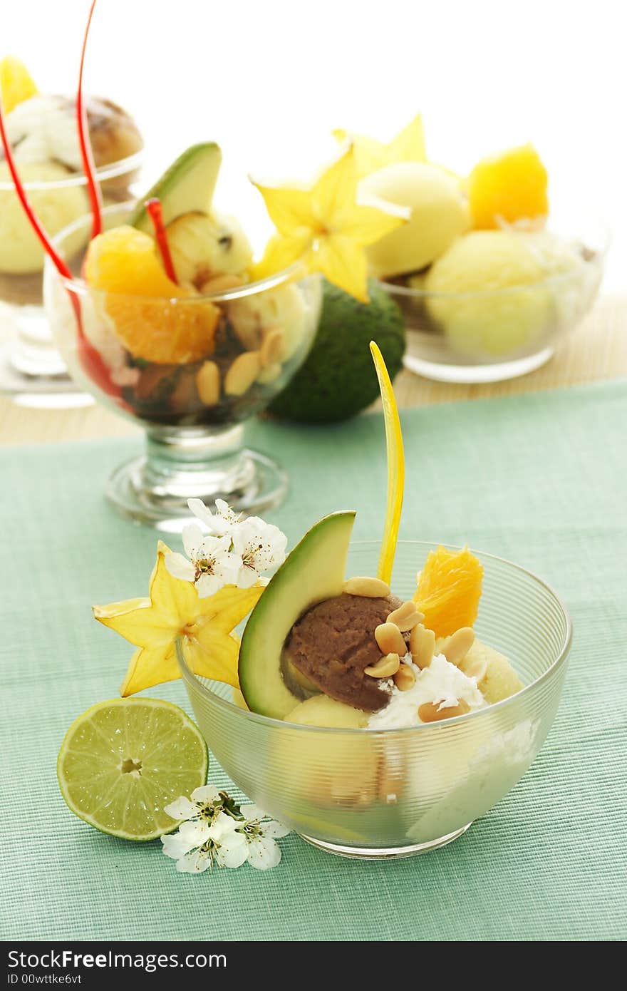 Ice cream with fresh fruits in a bowl close up. Ice cream with fresh fruits in a bowl close up