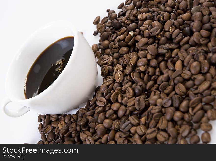 Coffee beans with a cup of coffee