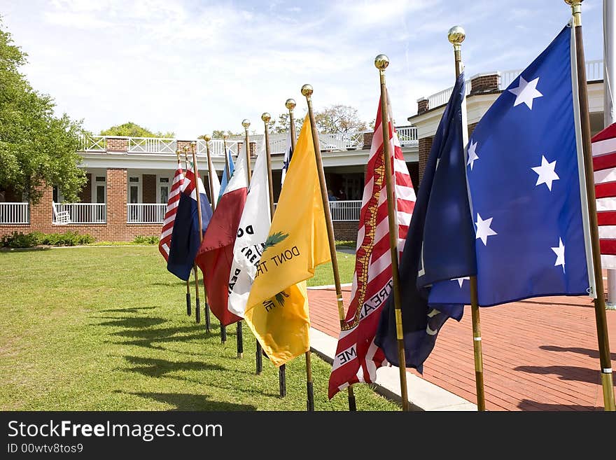 A display of historical American flags at an exhibit. A display of historical American flags at an exhibit