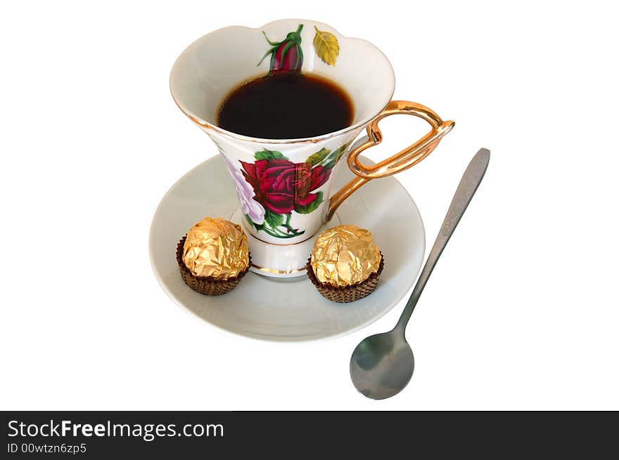 Old china cup of tea (or coffee) and sweeties on isolated background. Old china cup of tea (or coffee) and sweeties on isolated background.