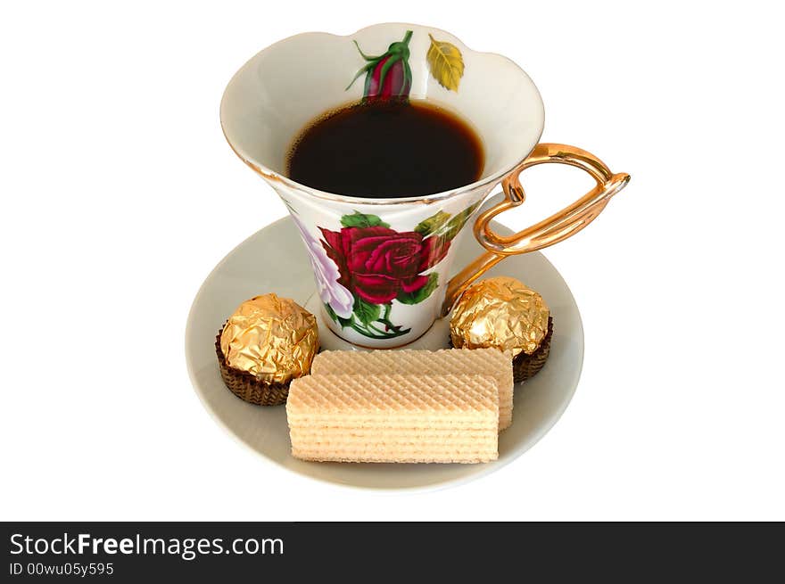 Old china cup of tea (or coffee) and sweeties on isolated background. Old china cup of tea (or coffee) and sweeties on isolated background.