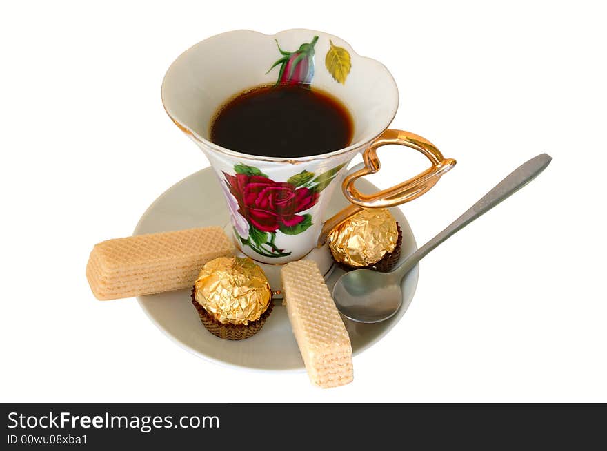 Old china cup of tea (or coffee) and sweeties on isolated background. Old china cup of tea (or coffee) and sweeties on isolated background.