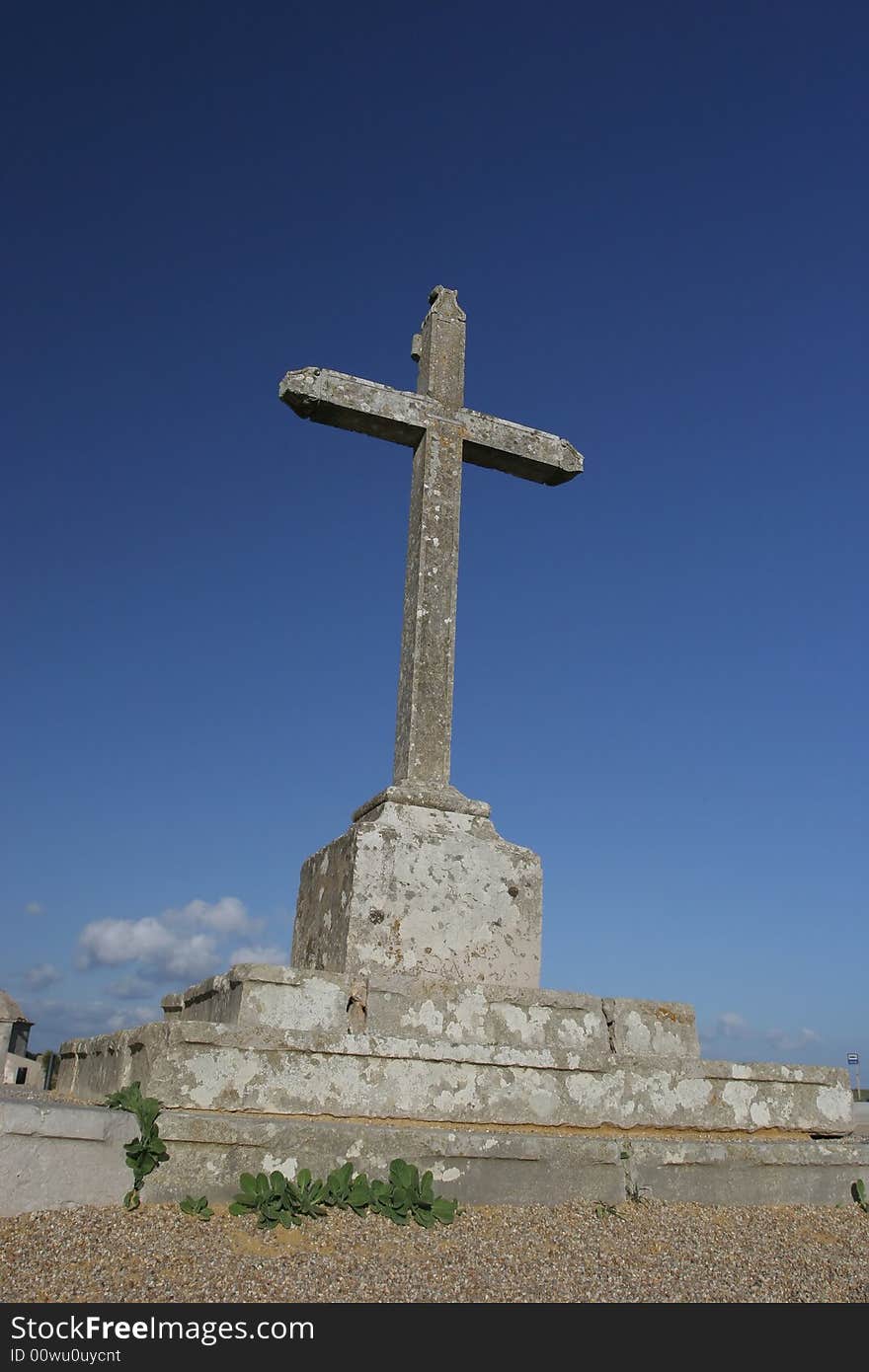 Big cross isolated in blue sky