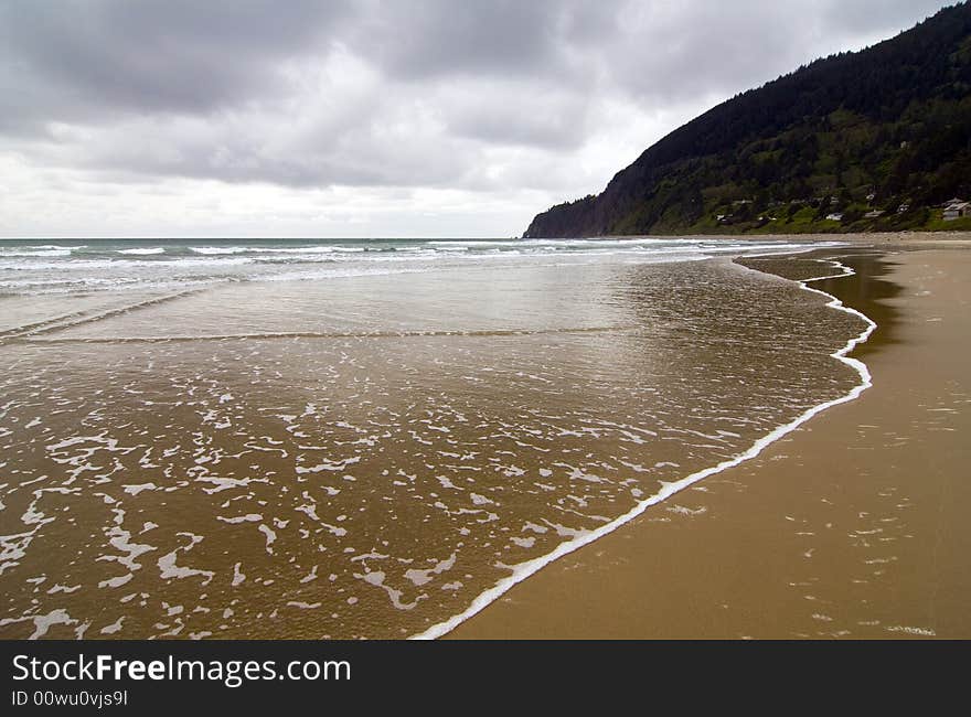 Gentle waves lapping the shore in central Oregon