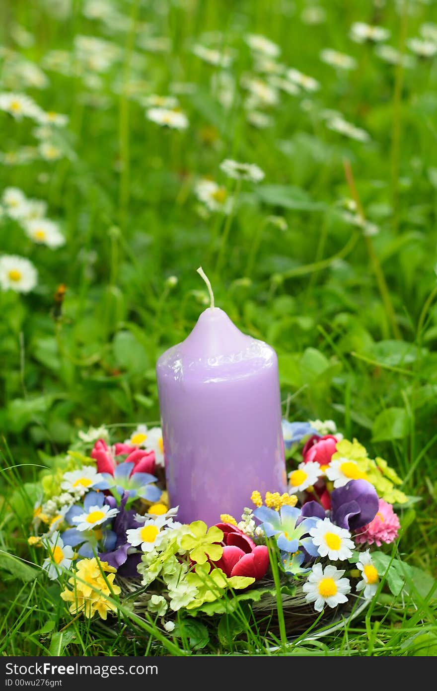 Easter decoration and candle in the garden