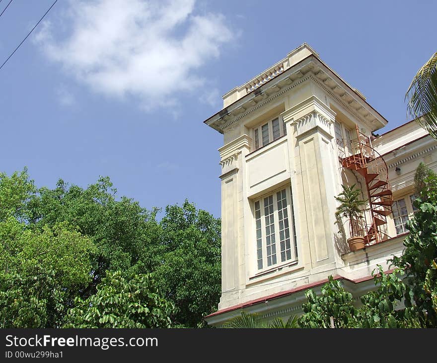 Yellow beautiful building with a stair in a side