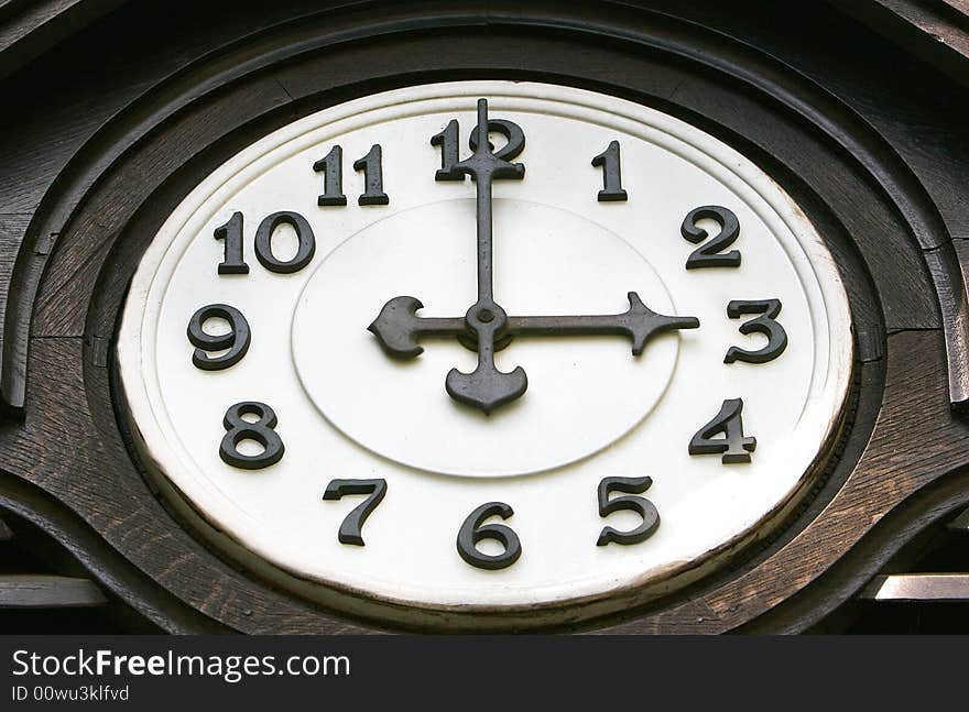 Close up of old wooden clock face