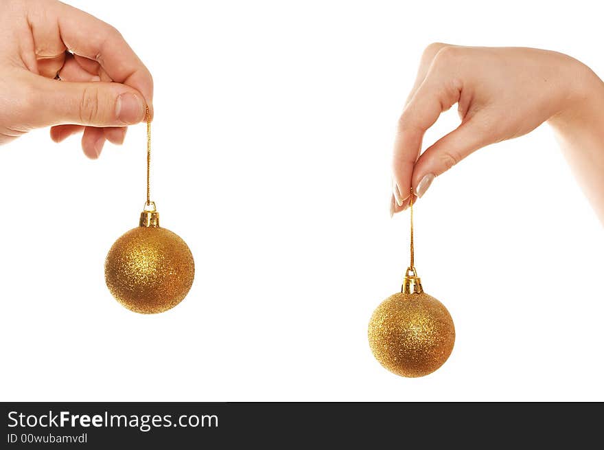 Hands holding Christmas balls isolated over white