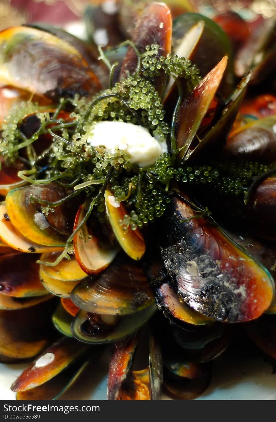 Baked mussel topped with sea weeds and mayo