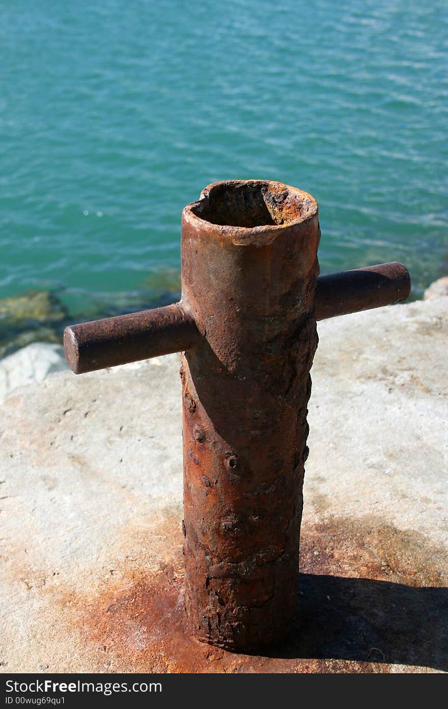 Old and Rusted Boat Anchor Pole at the harbour