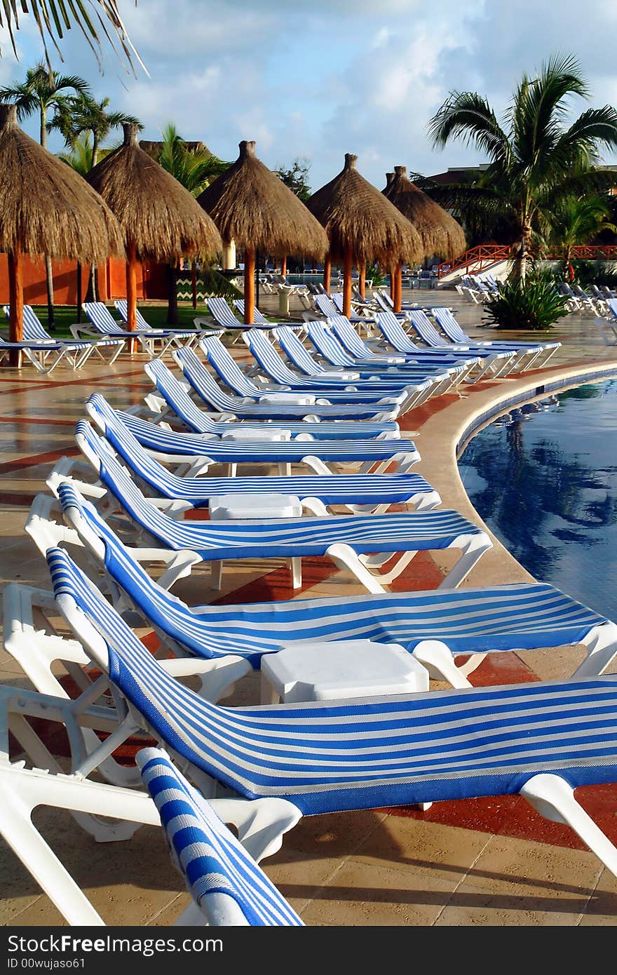 Pool with listed long chair around. Pool with listed long chair around