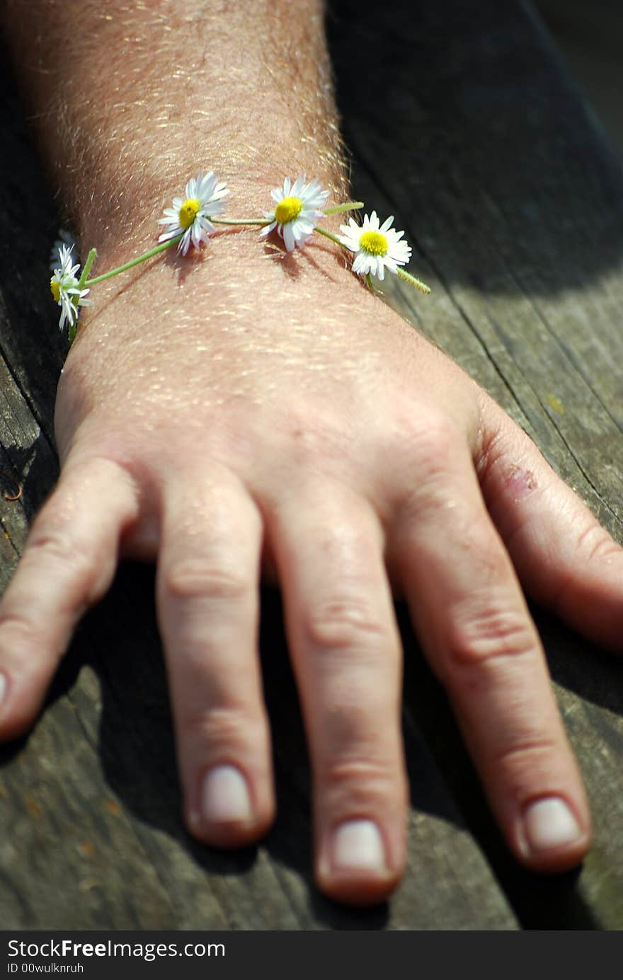 Man with daisy chain bracelet