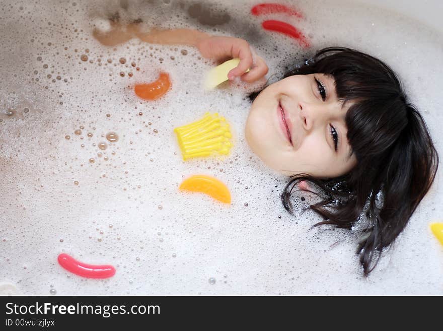 Girl having fun in the bathtub. Girl having fun in the bathtub