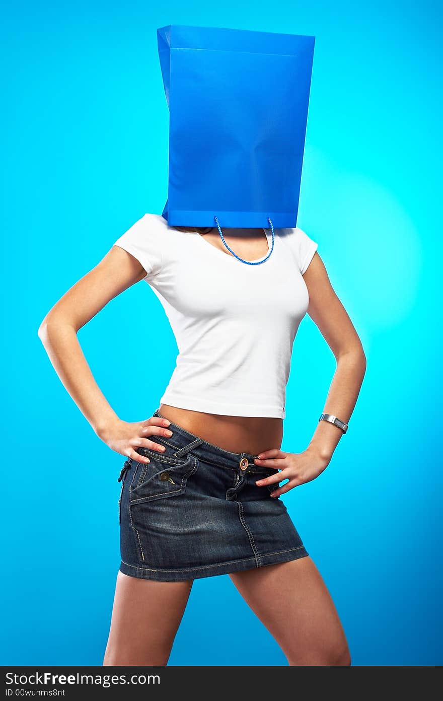 Shopping metaphor, woman with shopping bag over her head