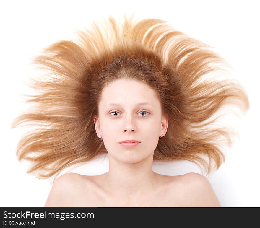 Pretty girl with flowing hair over white