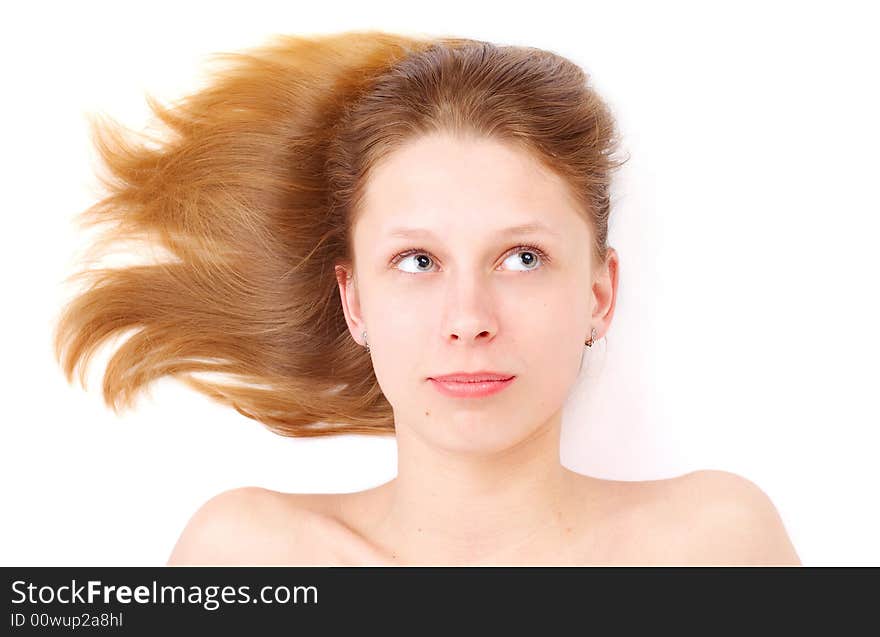 Pretty girl with flowing hair over white