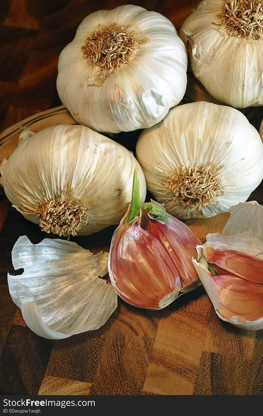 Garlic on a cutting board. Warm light and detail on the chopped slices