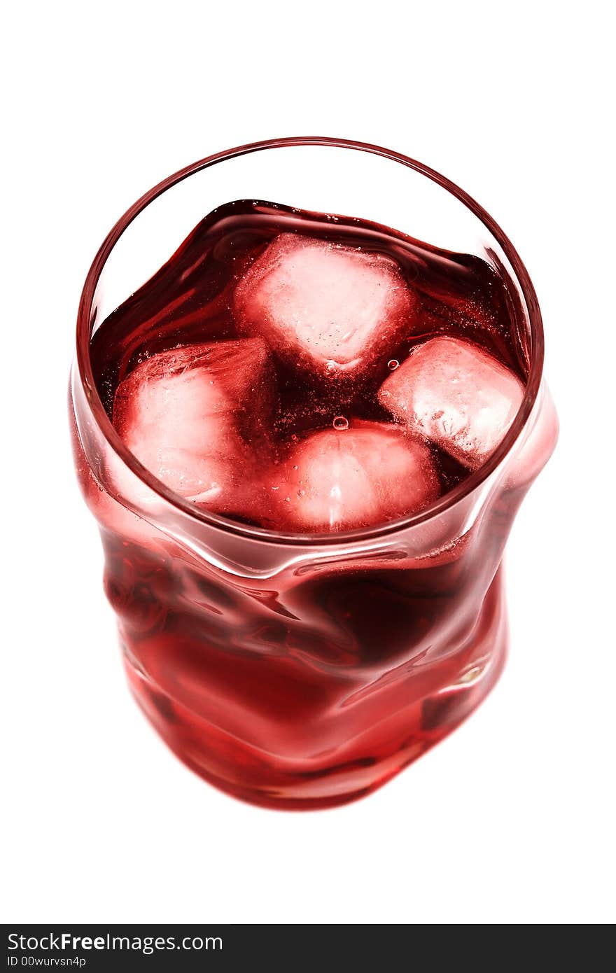 Glass with a cocktail and an ice on a white background