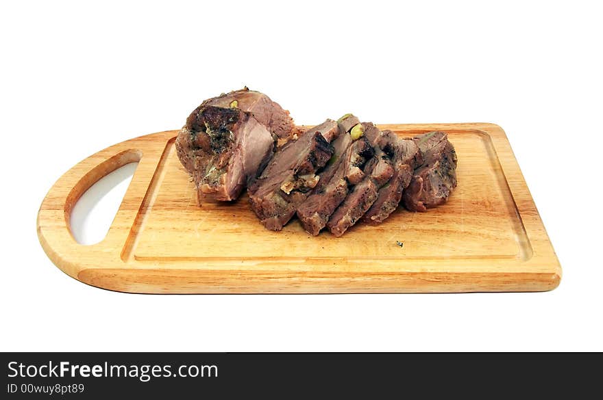 Appetizing boiled pork on a chopping board, cut on slices