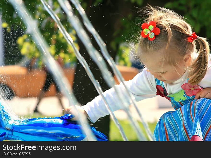 Little girl walks in park