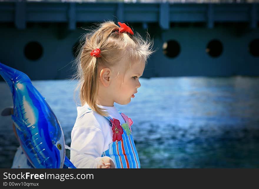 Little girl walks in park