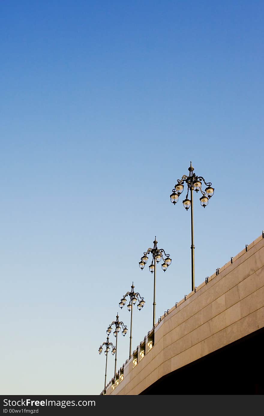 Several lamp posts on sky background