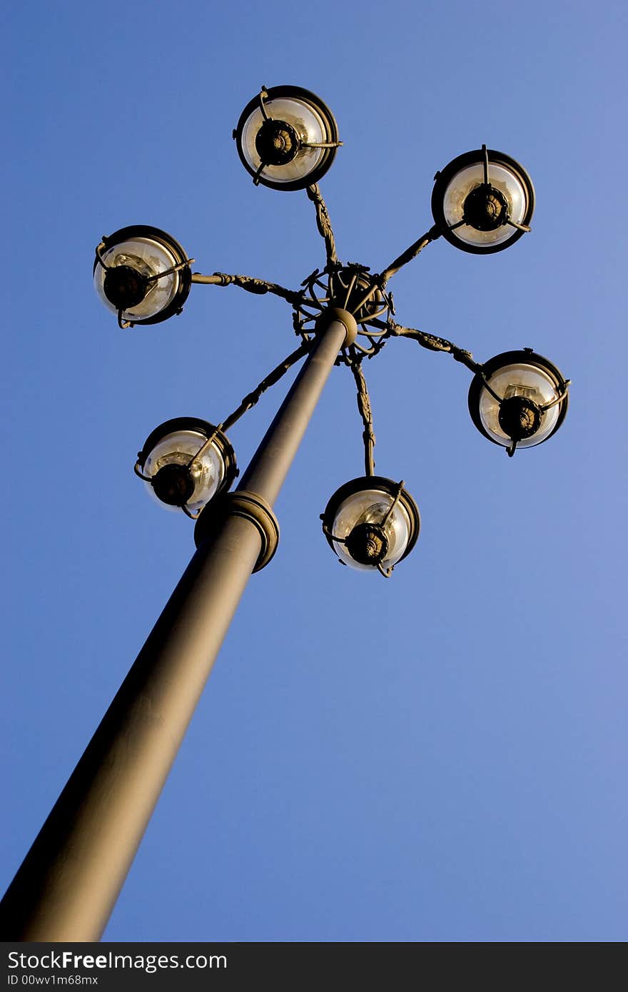 One lamp post on sky background