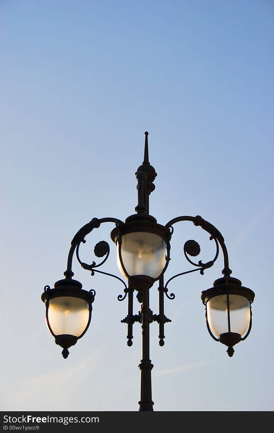 One lamp post on sky background