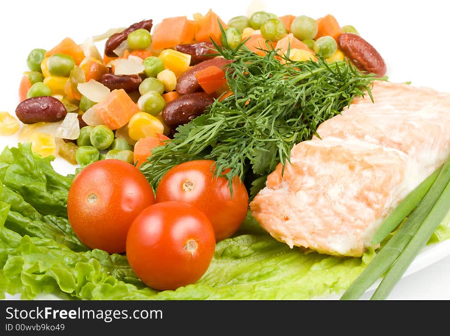 Stake from a salmon with vegetables on a plate