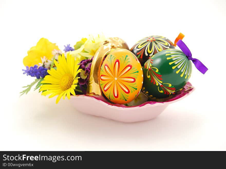 Easter basket with eggs and spring flowers