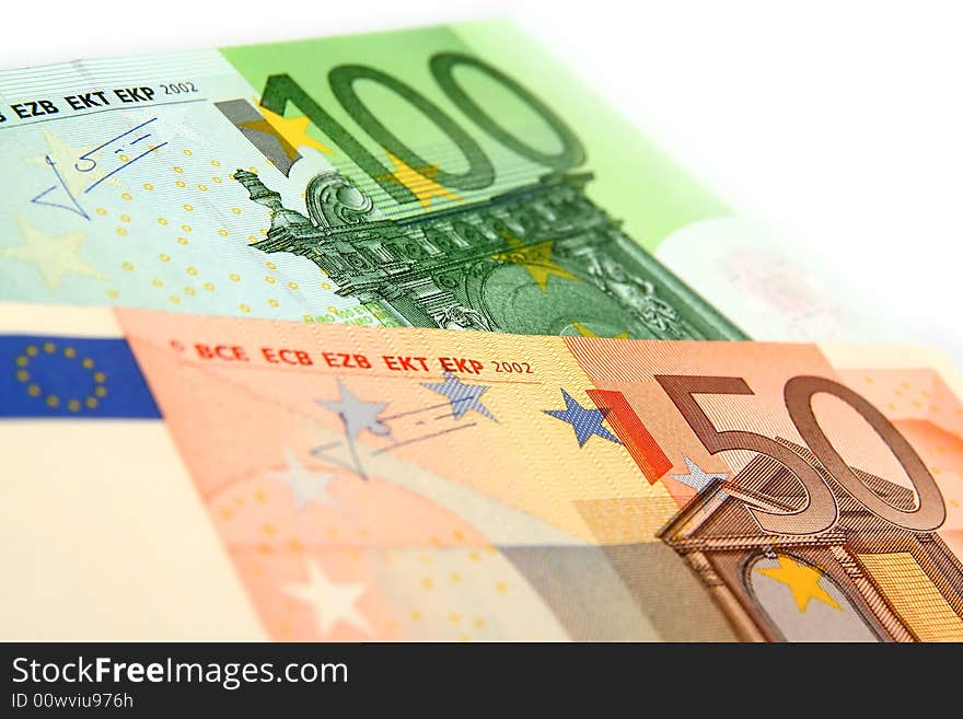 A few euro bills on a white background