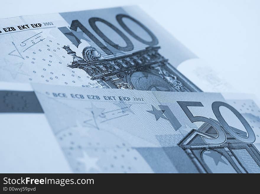 A few euro bills on a white background