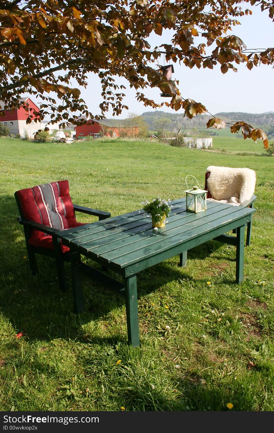 A quiet place in a park next to a farm in the summertime. A quiet place in a park next to a farm in the summertime