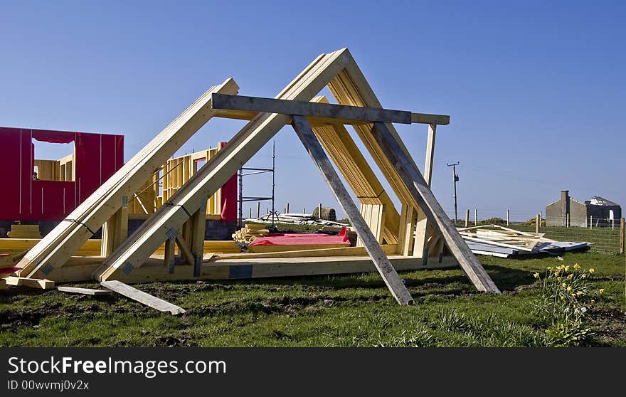 Roof Timbers in a Building yard. A timber roof truss is a structural framework of timbers designed to bridge the space above a room and to provide support for a roof.. The space between each truss is known as a bay. Rafters have a tendency to flatten under gravity, thrusting outwards on the walls. Ridge: The highest point of a pitched roof that receives the head of the spars &#x28;also called rafters or common rafters&#x29;. The table states that 2 X 6 rafters spaced 16 inches on centre &#x28;o.c&#x29; can span a maximum distance of 13 feet 5 inches. Another option is 2 X 8 rafters spaced 24 inches. . Roof Timbers in a Building yard. A timber roof truss is a structural framework of timbers designed to bridge the space above a room and to provide support for a roof.. The space between each truss is known as a bay. Rafters have a tendency to flatten under gravity, thrusting outwards on the walls. Ridge: The highest point of a pitched roof that receives the head of the spars &#x28;also called rafters or common rafters&#x29;. The table states that 2 X 6 rafters spaced 16 inches on centre &#x28;o.c&#x29; can span a maximum distance of 13 feet 5 inches. Another option is 2 X 8 rafters spaced 24 inches.