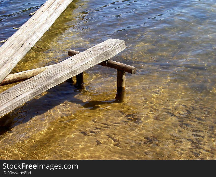 Old wooden pier on the lake