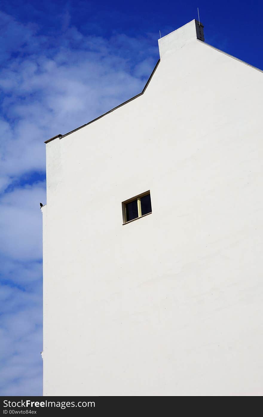 White Wall And Blue Sky