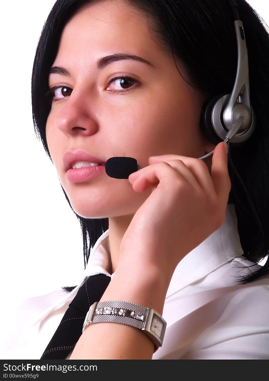 A portrait about a young pretty customer service representative lady with black hair who smiles, she has a headphone, and she wears a white shirt and a black tie