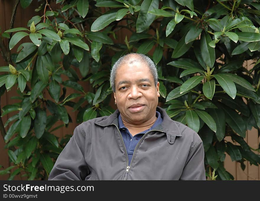 African american male relaxing at home on his patio deck.