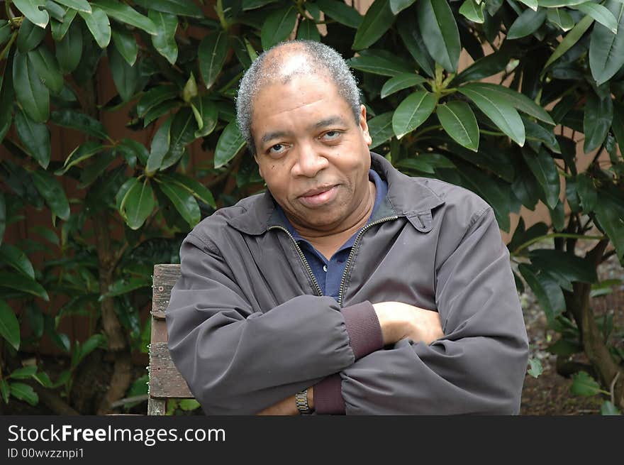 African american male relaxing at home on his patio deck.