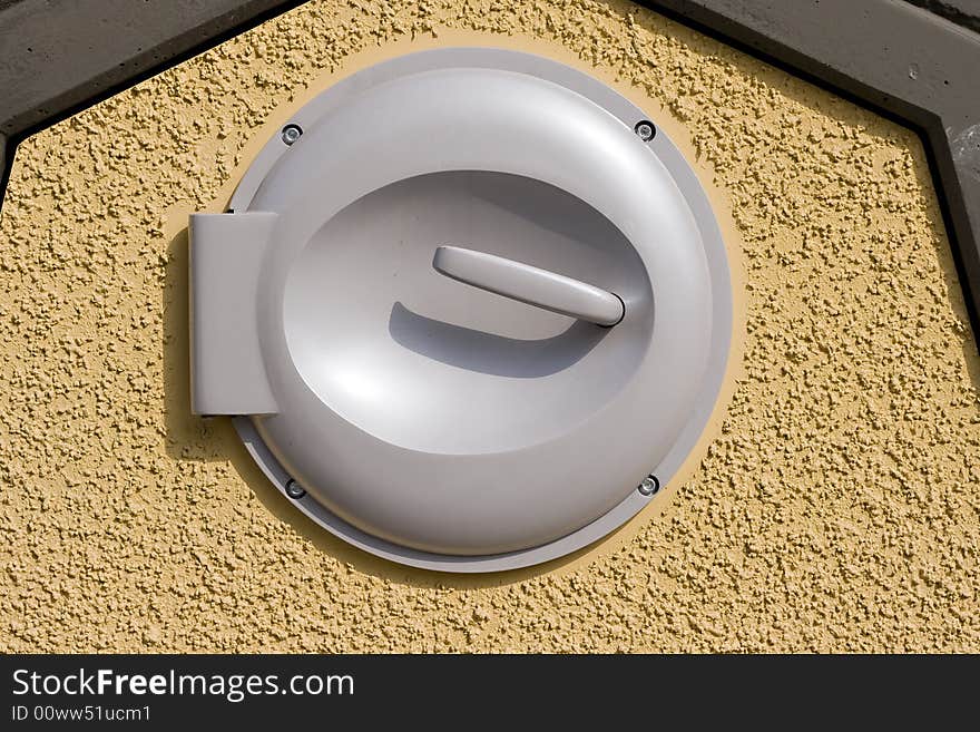 Trash can lid on wall with clipping path, stock photo