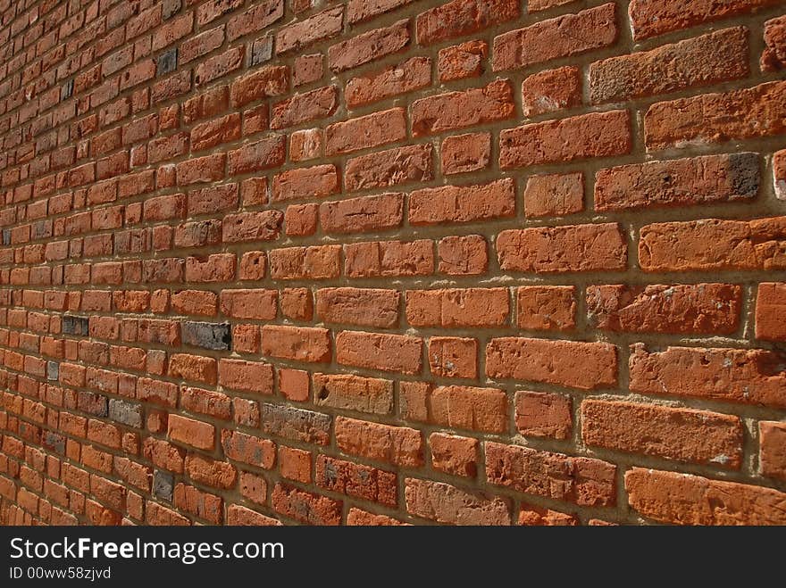 Red bricks wall around old town. Medieval construction. Red bricks wall around old town. Medieval construction.