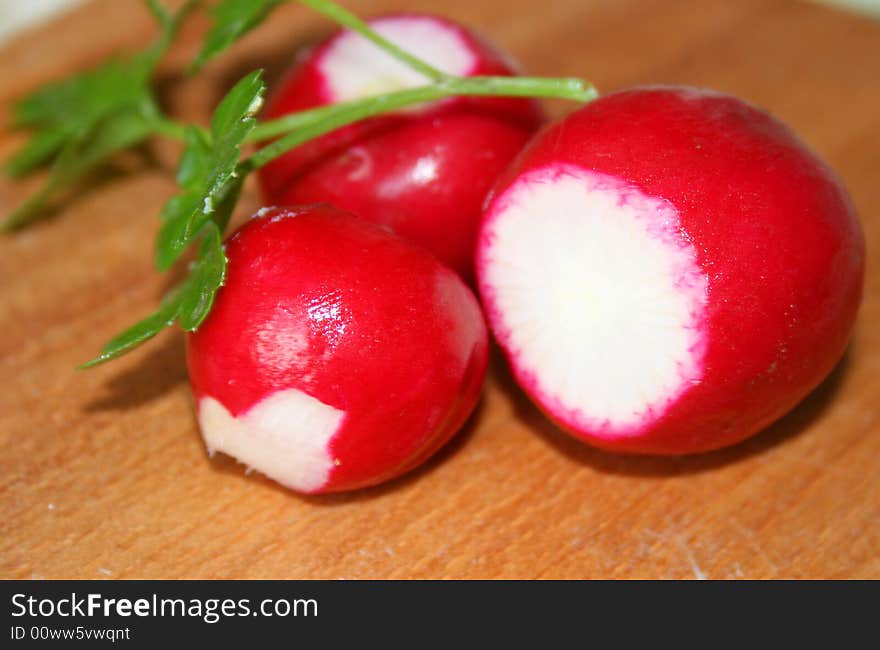 Red garden radish on a board