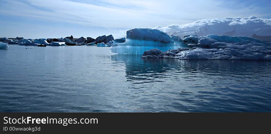 Panoramic view of a beautiful blue iceberg