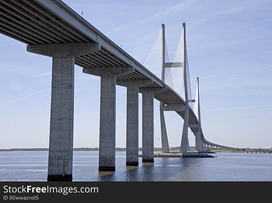 A new concrete and suspension bridge spanning a waterway. A new concrete and suspension bridge spanning a waterway